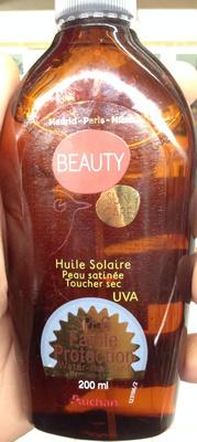 Huile solaire peau satinée toucher sec