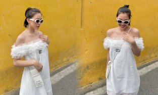 Hoa hậu Tiểu Vy về thăm quê với chiếc đầm hở trên hở dưới, đạp xe đi chơi