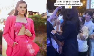 Á hậu Kim Duyên lấy vạt áo của nhân viên làm giẻ lau màn hình điện thoại