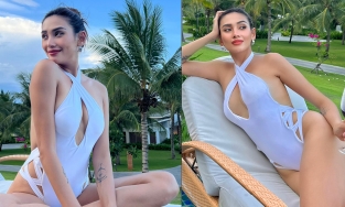 Võ Hoàng Yến diện áo tắm trắng tinh khôi nhưng xẻ bạo, khoe hình thể nuột nà tuổi 34