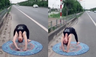 Cô gái thản nhiên tập Yoga trên đường cao tốc mặc xe cộ qua lại