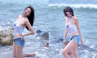 Cao Thái Hà mặc quần sooc jean ngắn cũn đi biển khoe trọn cặp chân trắng nõn, dài miên man