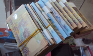 Đổi tiền lẻ dịp Tết kiếm lời có thể bị xử phạt 80 triệu đồng