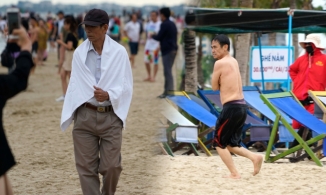 Người dân mặc áo khoác xuống biển tắm, 2 phút đã phải đi lên trong kì nghỉ lễ 30/4 - 1/5