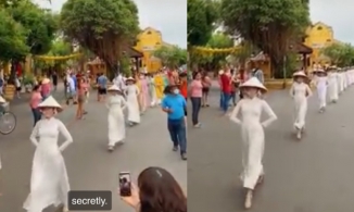 Màn biểu diễn áo dài lạ lùng ở Hội An khiến netizen phán 'thoái hoá cột sống, thoát vị đĩa đệm'