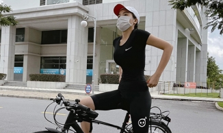 Kỳ Duyên lên đồ kín mít vẫn khoe trọn thân hình Hoa hậu Biển trên xe đạp