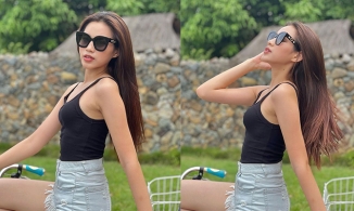 Đỗ Thị Hà mặc quần shorts ngắn áo hai dây đạp xe đạp, khoe nhan sắc mơn mởn tuổi 21