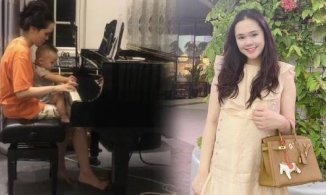 Bà xã Duy Mạnh mặc đồ bộ, tóc túm vội ngồi ôm con như mẹ bỉm bình dân