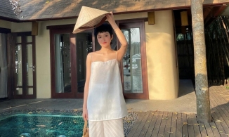 Chán bikini, Hiền Hồ chuyển sang tạo dáng dịu dàng, nên thơ cùng nón lá