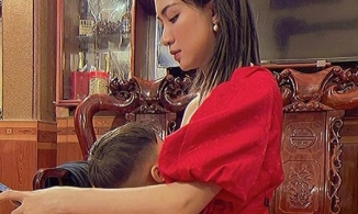 Hòa Minzy đăng ảnh vừa làm việc vừa vạch áo cho con bú