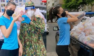 Rũ bỏ hình ảnh Hoa hậu, Tiểu Vy hóa lực sĩ vác thực phẩm cho người dân