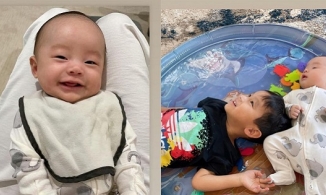 Mới 2 tháng tuổi, cậu út nhà Hoa hậu Phạm Hương đã có nụ cười lãng tử