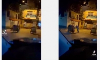 Bé trai 2 tuổi đạp xe theo mẹ lao công đi gom rác giữa đêm đông