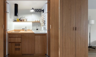 Căn hộ thông tầng 33m² đẹp từng centimet nhờ 'giấu' phòng bếp trong tủ gỗ