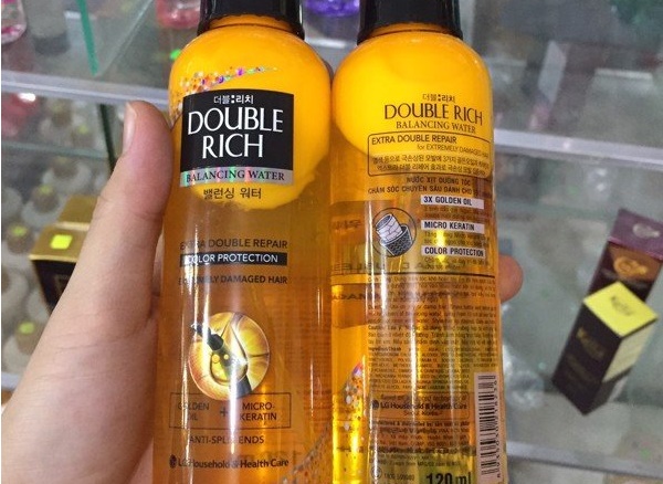 Xịt dưỡng tóc Double Rich màu vàng giúp dưỡng tóc mềm mượt, giảm gãy rụng, giảm gàu.