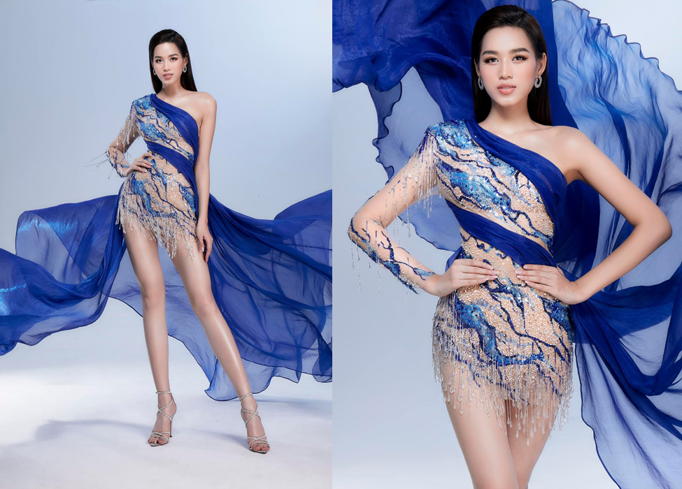 Thiết kế được lấy cảm hứng từ dòng sông xanh mướt chảy qua quê hương Thanh Hoá, sự độc đáo ở chất liệu xuyên thấu đính kết pha lê giọt nước và phần tà váy ôm quanh vóc dáng, tung bay mỗi khi di chuyển.