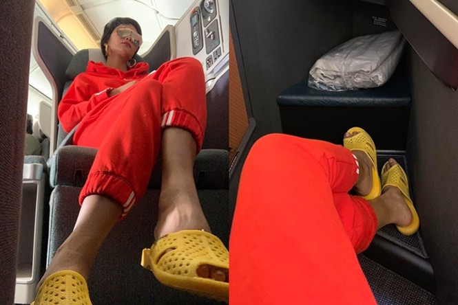 Hoa hậu H'hen Niê không ngại diện dép tổ ong giản dị với set đồ đỏ theo style thể thao khi ngồi trên máy bay khoang hạng A