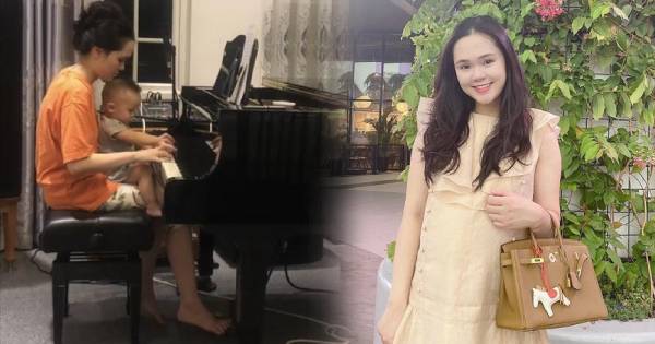 Bà xã Duy Mạnh mặc đồ bộ, tóc túm vội ngồi ôm con như mẹ bỉm bình dân