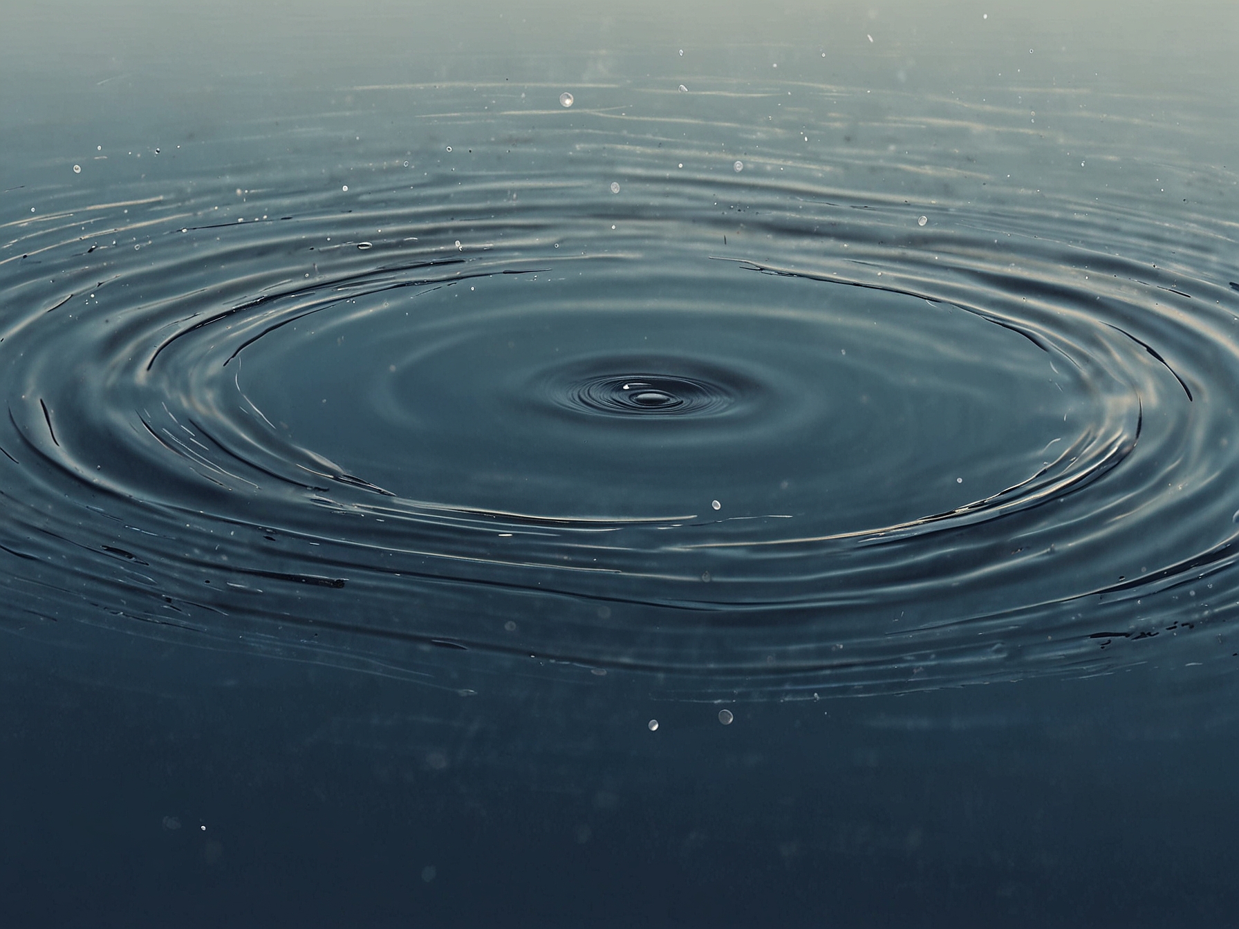 An artistic representation of a ripple in water, symbolizing the impact of a simple flirty message that creates waves of emotions in a relationship.