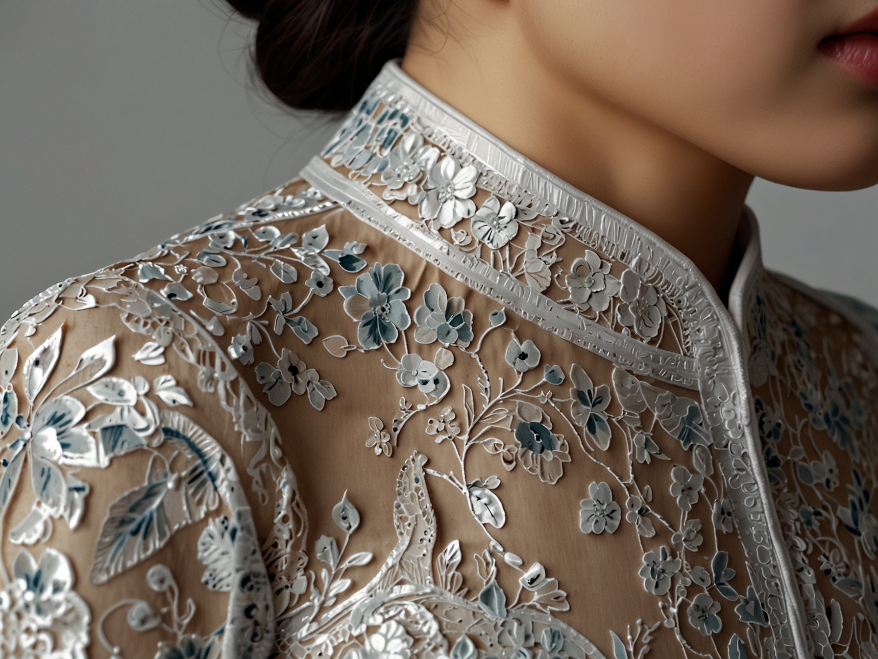 A close-up of intricate details from a contemporary ao dai, highlighting the delicate fabrics and unique embroidery that bridges traditional and modern aesthetics.