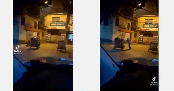 Bé trai 2 tuổi đạp xe theo mẹ lao công đi gom rác giữa đêm đông