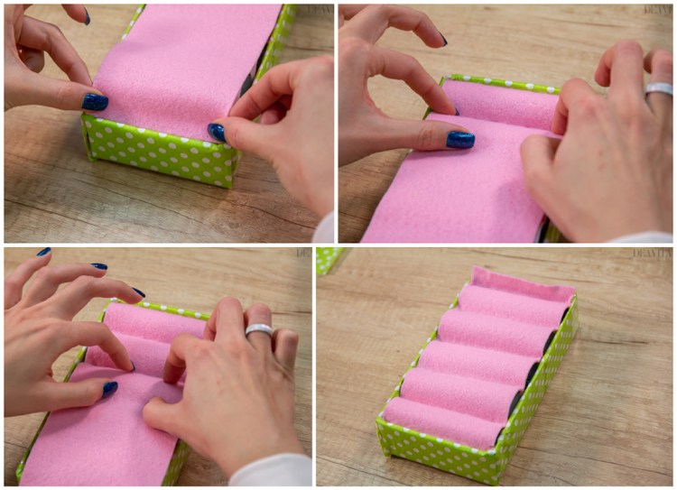 Dùng keo dán miếng vải nỉ vào hộp, chèn miếng vải vào sâu trong các khe giữa những lõi giấy.