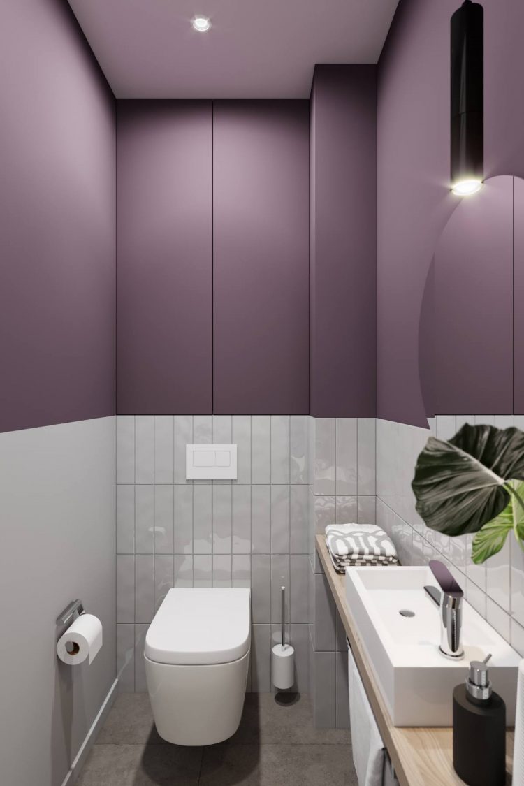 Bức tường ở khu vực toilet được chia thành hai màu trắng và tím trông vô cùng nổi bật và mộng mơ.