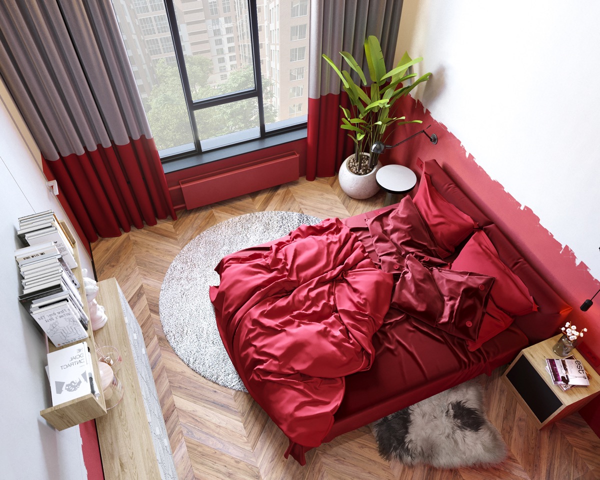 Hiệu ứng sơn đỏ “nguệch ngoạc” ở phần dưới bức tường tạo nên sự liền mạch với tấm rèm che ô cửa sổ màu đỏ - xám. Toàn bộ giường ngủ, chăn ga gối đều sử dụng một màu đỏ trên nền sàn gỗ cho phòng ngủ đã ấm áp càng thêm phần ấm áp.