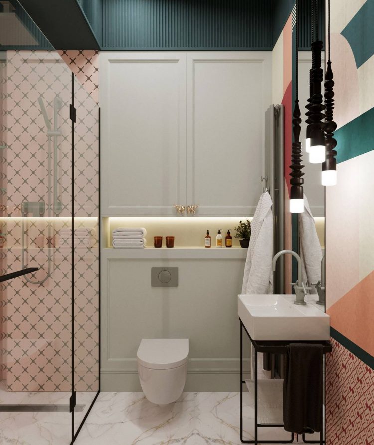Thiết kế toilet gắn tường cùng hệ thống tủ lưu trữ giúp cho phòng tắm nhỏ trông vẫn thoáng và gọn gàng, đẹp mắt.