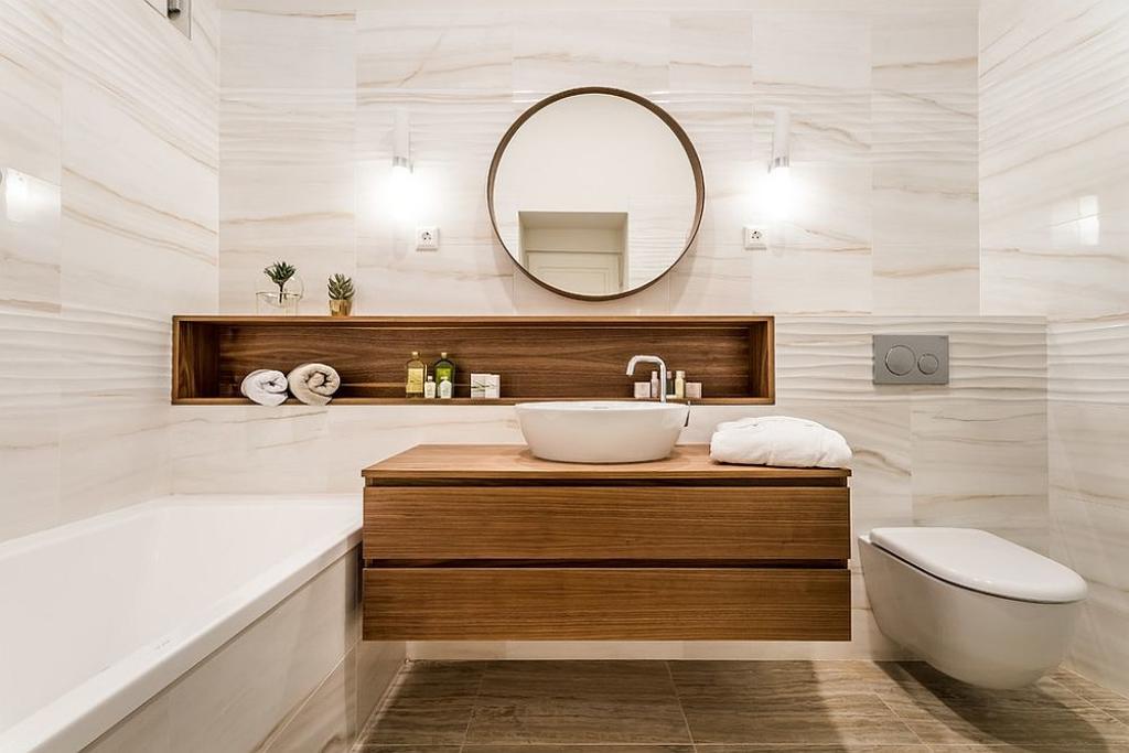Bồn rửa tay bằng sứ trắng bóng kết hợp tủ lưu trữ gỗ gắn tường cho vẻ đẹp hiện đại.