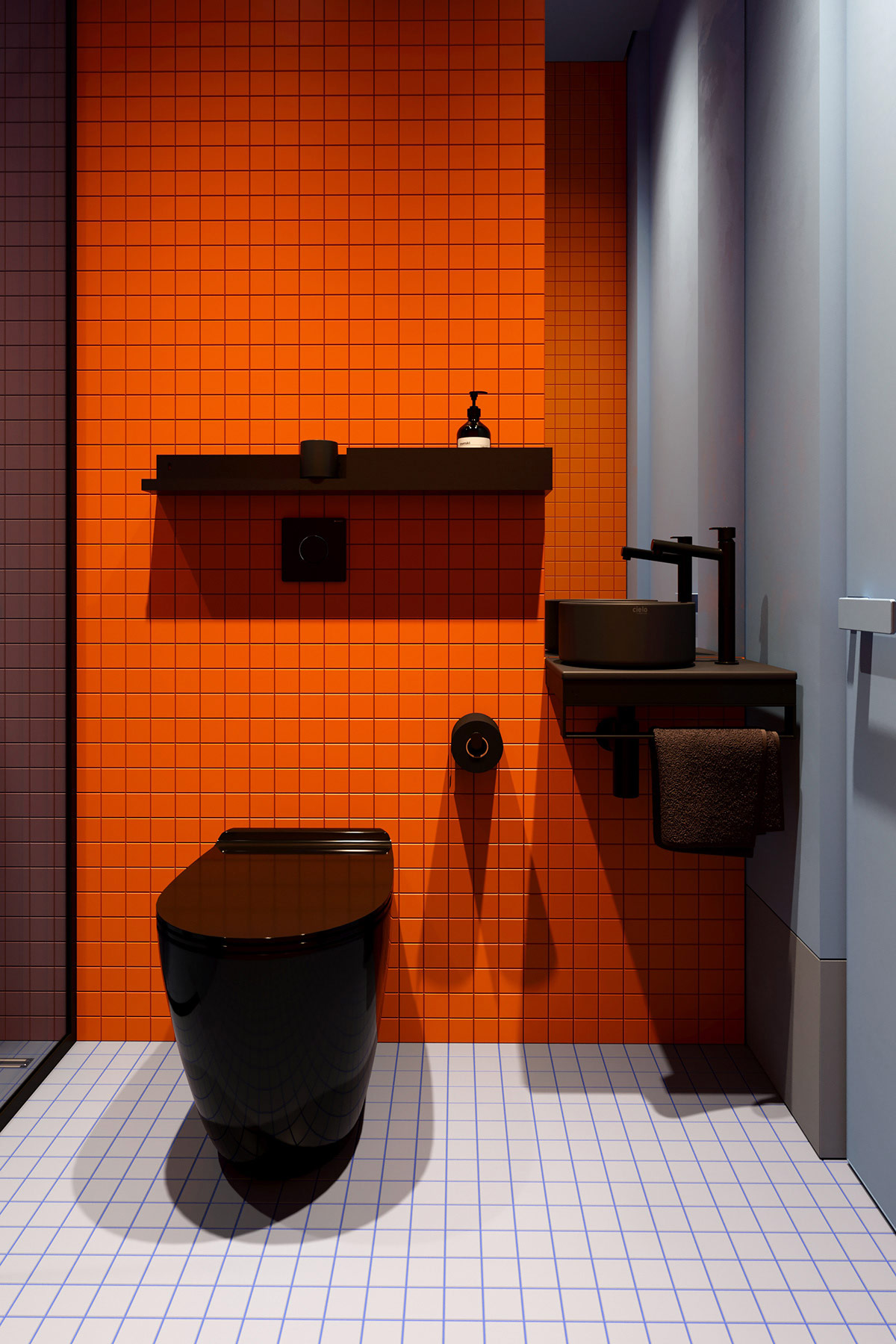 Nội thất nhà vệ sinh sử dụng gam màu đen tuyền cho cảm giác bí ẩn và tạo chiều sâu. Hơn nữa, màu đen cho bồn toilet, bồn rửa, kệ mở gắn tường cũng dễ dàng vệ sinh và che vết bẩn hơn so với màu trắng quen thuộc.