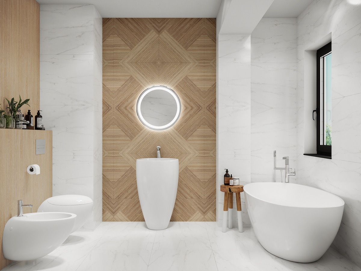 Phòng tắm đầu tiên lựa chọn gam màu trắng chủ đạo, một phông nền hoàn hảo để tôn lên vẻ đẹp của bức tường ốp gỗ. Bức tường vật liệu gỗ sáng màu, họa tiết hình học đan xen cho cái nhìn trang nhã nhưng cũng không kém phần hiện đại.