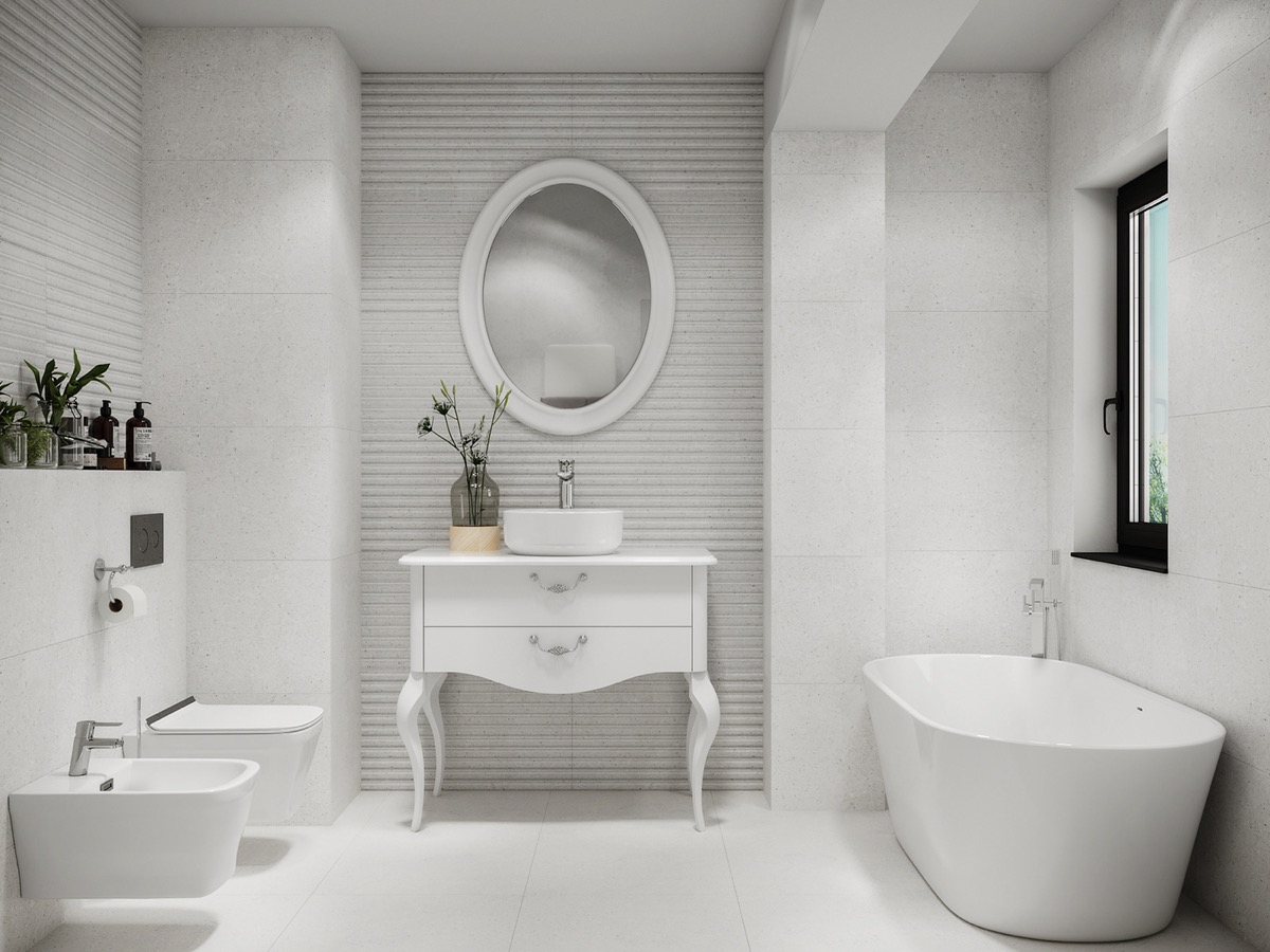 Phòng tắm xinh đẹp thiết kế theo phong cách cổ điển, với chiếc tủ lưu trữ hai ngăn kéo với phần tay cầm sắc sảo. Tấm gương hình oval cùng lọ hoa thủy tinh tạo điểm nhấn tinh tế cho không gian thư giãn. 