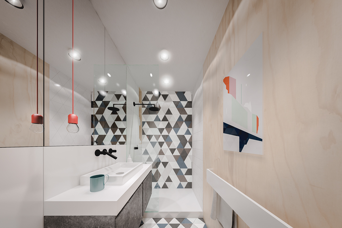 Phòng tắm thiết kế dài và hẹp, vậy nên một tấm gương lớn có kích thước gần như bao phủ toàn bộ bức tường trên bồn rửa giúp “đánh lừa thị giác” để nhân đôi không gian này. 