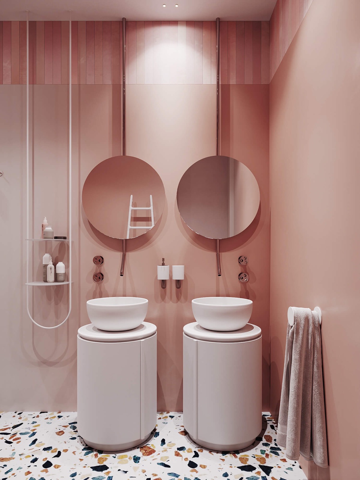 Toàn bộ bức tường bao phủ màu hồng phấn với 2 tấm gương tròn vừa tạo hiệu ứng phản chiếu ánh sáng vừa “nhân đôi” không gian về mặt thị giác. Sàn nhà lát gạch terrazzo trở thành điểm nhấn nổi bật để phòng tắm không rơi vào trạng thái một màu.