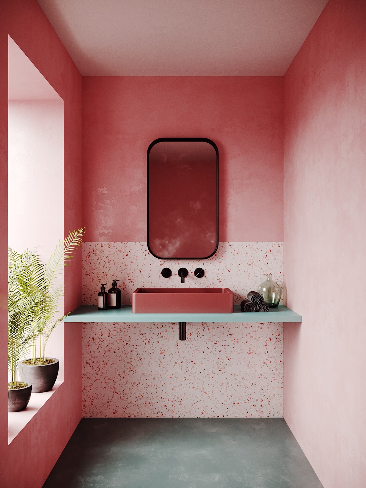 Một phòng tắm kết hợp được cả hai yếu tố dịu dàng và mạnh mẽ nhờ bức tường sơn màu hồng kết hợp ốp gạch terrazzo, kệ mở màu xanh, những chậu cây cảnh trang trí và sàn nhà bê tông. Tất cả tạo nên sự hài hòa và tươi sáng tuyệt đối!
