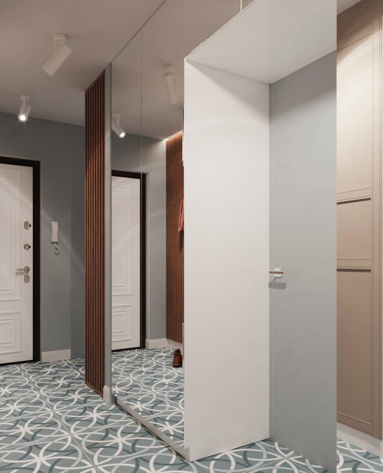 Lối vào căn hộ khá dài và hẹp, vì thế, tấm gương to và rộng được bố trí từ trần đến sàn nhà đã tạo nên hiệu ứng cho không gian rộng thoáng hơn so với diện tích thật.