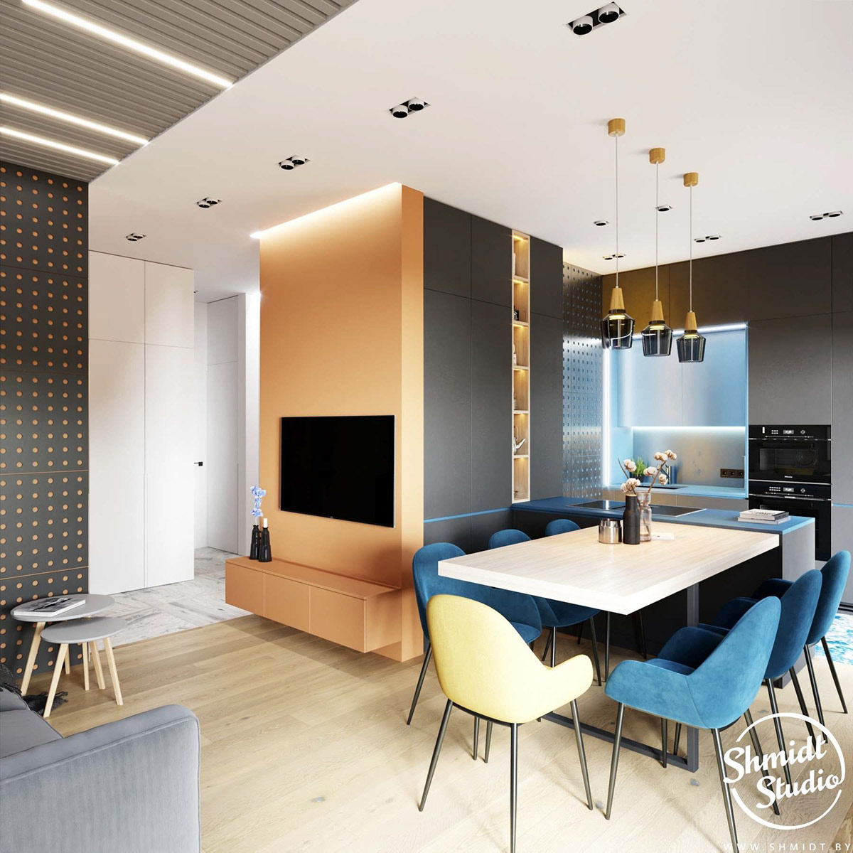 Căn hộ thứ hai cũng sử dụng gam màu cam và xanh lam chủ đạo nhưng màu cam có sắc thái dịu nhẹ hơn so với căn hộ được giới thiệu đầu tiên. Vì diện tích khá “khiêm tốn” nên các nhà thiết kế đã lựa chọn thiết kế mở cho khu vực sinh hoạt chung, bao gồm phòng khách, bếp và khu vực ăn uống.
