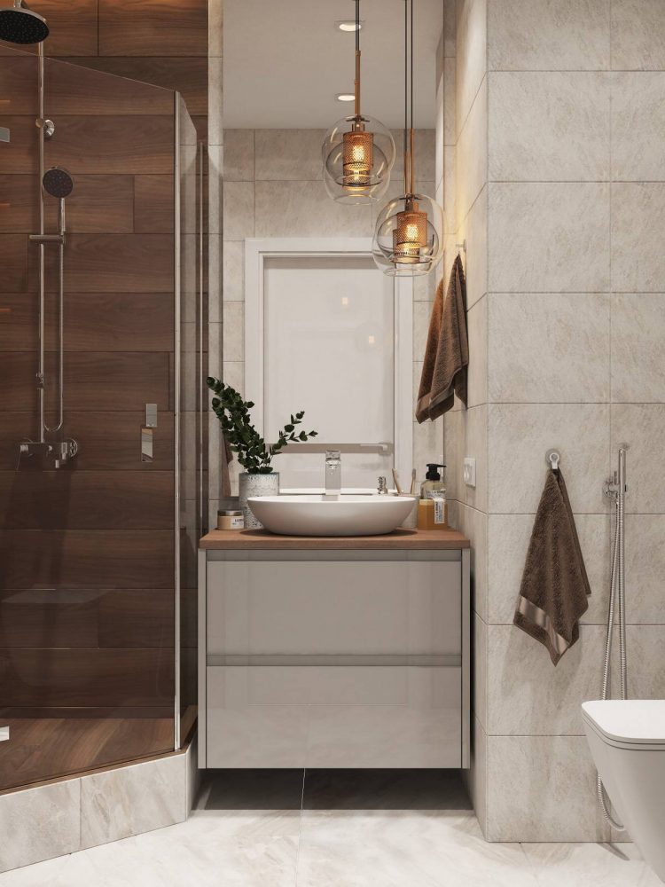 Phòng tắm nhỏ xinh tận dụng hốc tường để bố trí bồn rửa kết hợp tủ lưu trữ gắn tường, cả bồn toilet cũng giải phóng diện tích mặt sàn để vệ sinh dễ dàng hơn.
