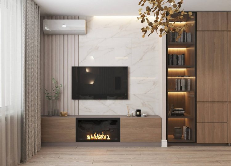 Đối diện sofa là bức tường dùng để lắp đặt máy điều hòa không khí, tivi, hệ thống tủ lưu trữ kết hợp kệ mở bằng gỗ tối màu kết hợp đèn LED ẩn bên trong đẹp mắt.