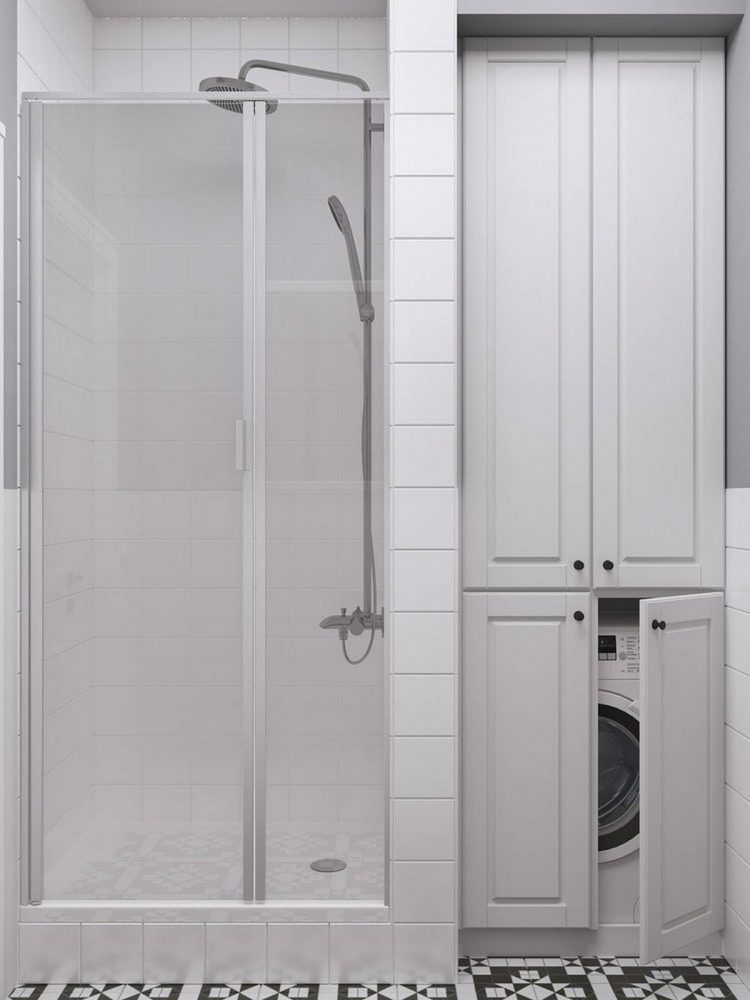 Buồng tắm đứng thiết kế cao hơn mặt sàn khoảng 20cm với cửa kính trong suốt, bên cạnh là tủ lưu trữ tích hợp khu vực “giấu” máy giặt một cách gọn gàng, đẹp mắt.