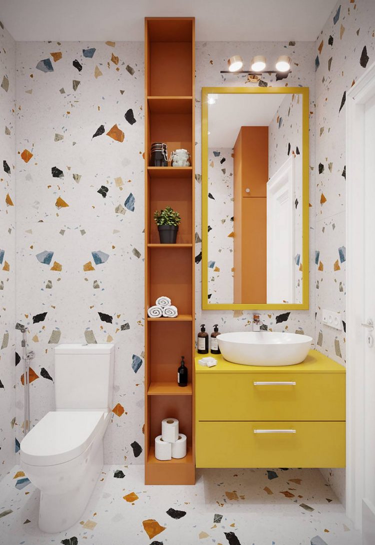 Cả khu vực sàn nhà và tường phòng tắm đều sử dụng gạch terrazzo đủ sắc màu cho cái nhìn sống động, những sắc màu thuộc gam màu nóng như vàng, cam được chọn lựa để phòng tắm vốn lạnh lẽo trở nên ấm áp hơn.