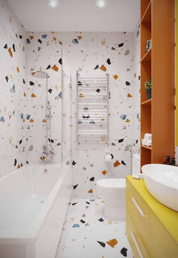 Hệ thống tủ kệ lưu trữ và giá treo khăn tắm gắn tường giúp cho phòng tắm nhỏ gọn gàng, ngăn nắp và tăng tính thẩm mỹ. Tấm kính trong suốt phân cách bồn tắm và toilet một cách nhẹ nhàng.