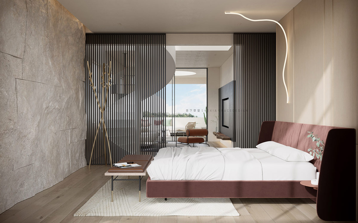 Phòng ngủ đẹp như một bức tranh với tường đá gồ ghề, sàn gỗ, khung giường màu đỏ mận quyến rũ cùng lam gỗ màu đen tạo nên vẻ hòa quyện giữa cổ điển và hiện đại.