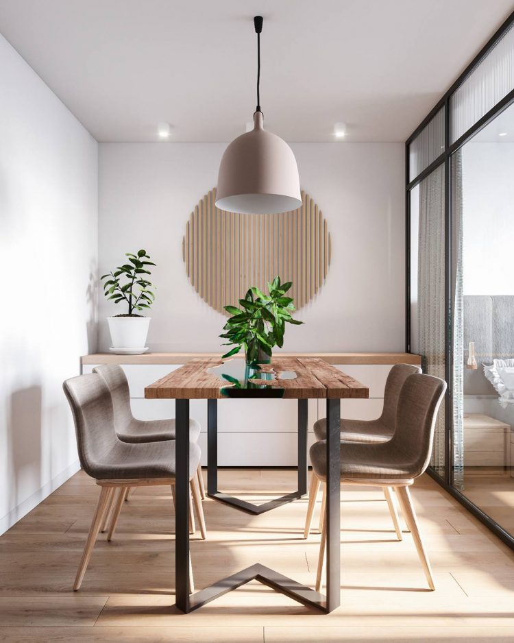 Khu vực ăn uống với bộ bàn ghế gỗ tiện nghi và đèn thả trần màu be cực kỳ sang trọng. Trên tường là hình tròn được ghép từ những thanh gỗ đơn giản mà ấn tượng.