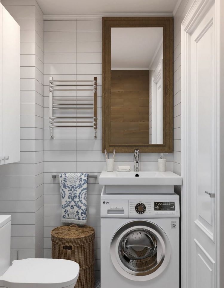 Bên dưới bồn rửa được bố trí máy giặt để tiết kiệm không gian. Một vài điểm nhấn từ giỏ mây màu nâu, tấm gương hình chữ nhật treo dọc bức tường với viền khung gỗ khiến căn phòng như được 'nhân đôi' bằng thị giác.
