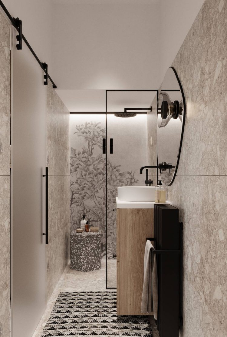 Phòng tắm nhỏ hẹp sử dụng cửa trượt cánh mờ, buồng tắm được phân vùng với nhà vệ sinh bằng cửa kính trong suốt với những chi tiết viền đen nổi bật.
