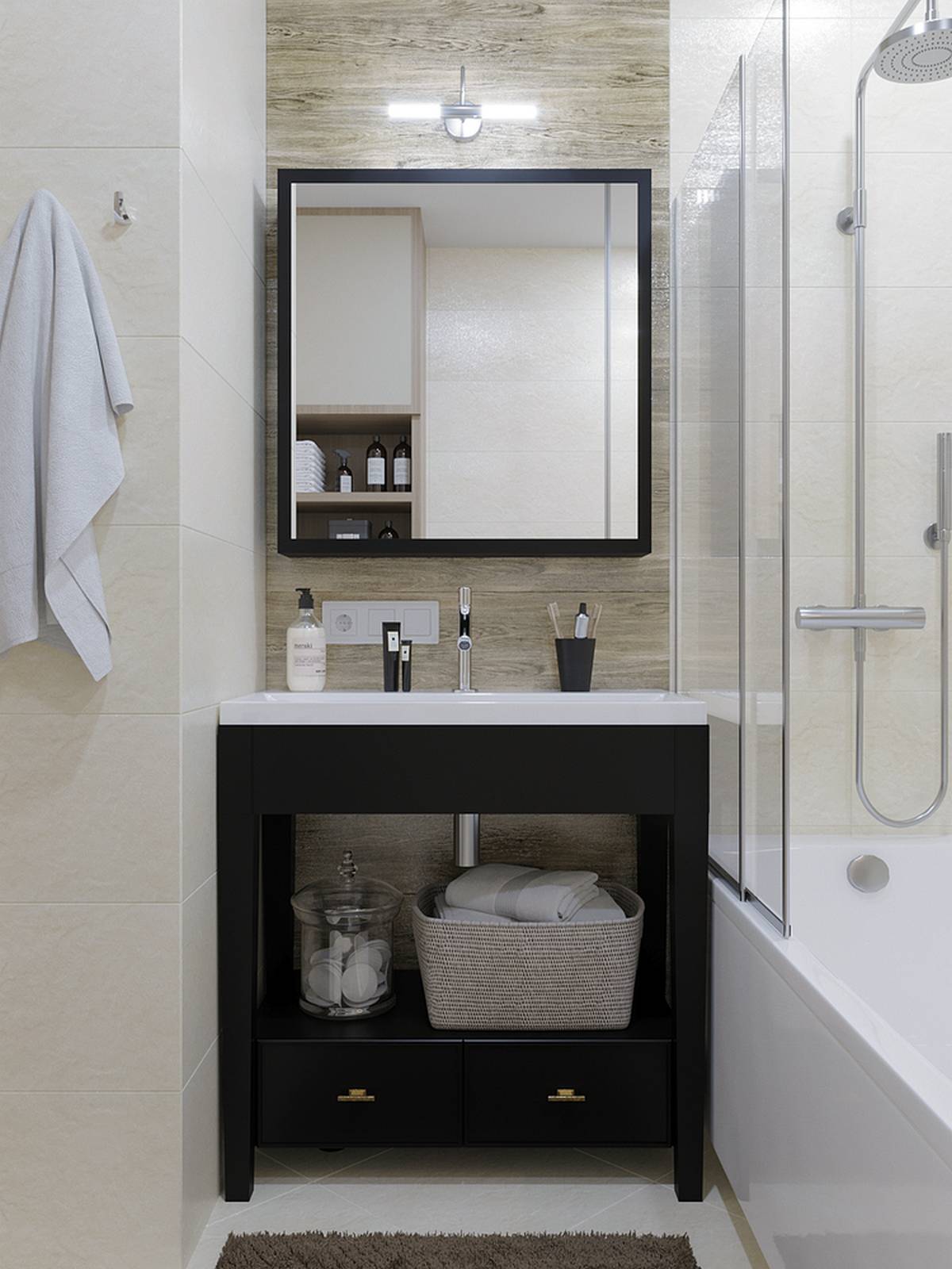 Khu vực bồn rửa tay kết hợp tủ sơn màu đen nổi bật trên phông nền trung tính. Tấm gương soi hình vuông cũng góp phần phản chiếu ánh sáng và nhân rộng không gian.
