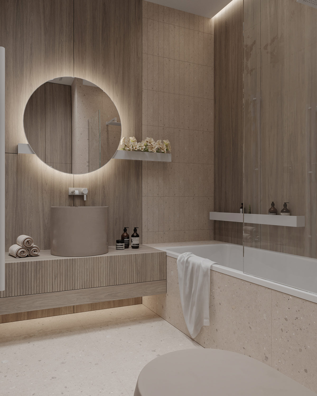 Bên trong phòng tắm, đồ nội thất đặt thiết kế riêng để tận dụng tối đa kích thước của căn phòng. Một bồn rửa hình trụ sâu lòng kết hợp tủ lưu trữ gắn tường, đây là một sự phù hợp tùy chỉnh cho khoảng cách giữa bồn tắm và tường vào phòng tắm.