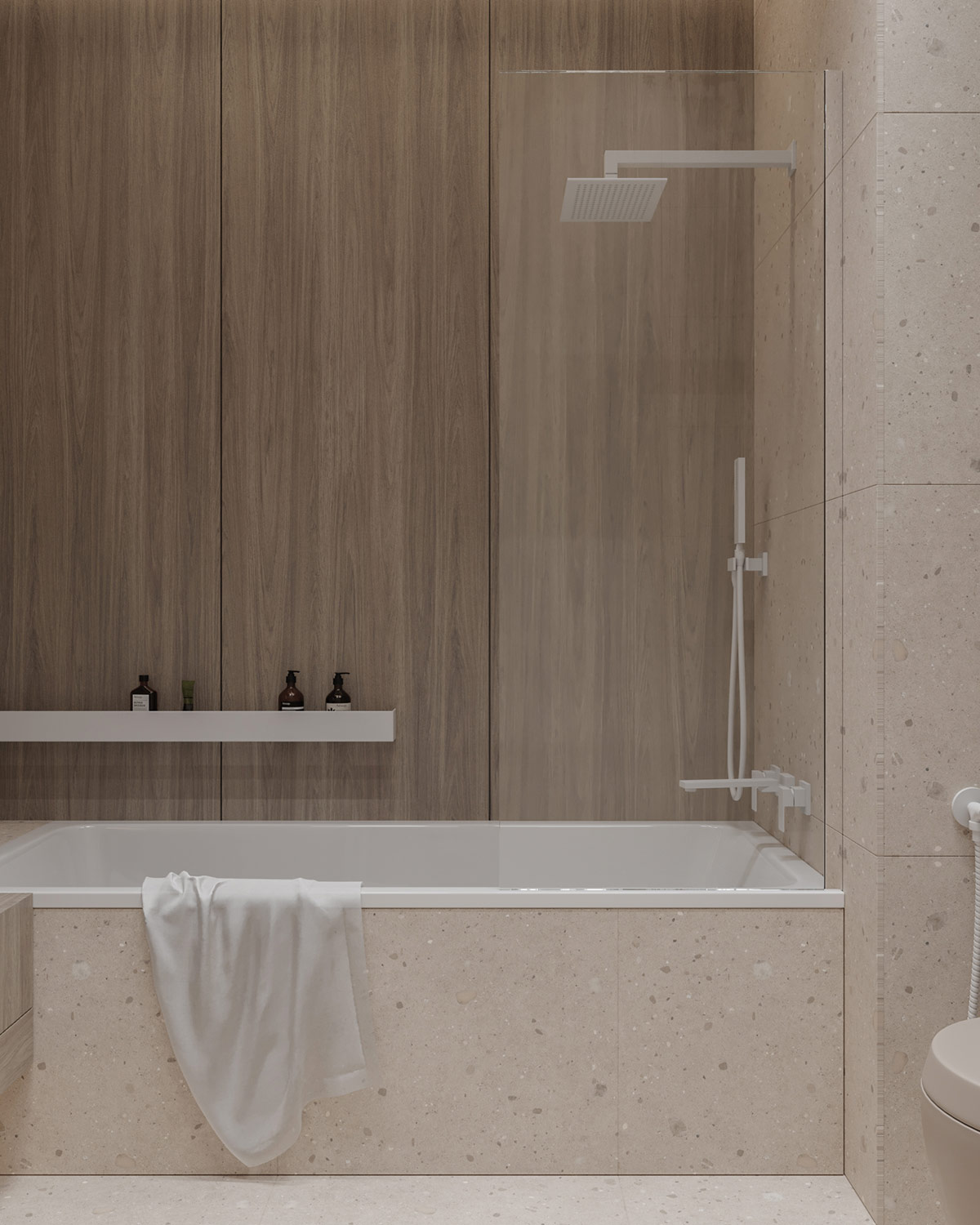 Bồn tắm phân vùng với nhà vệ sinh bằng tấm kính trong suốt, các vật liệu gỗ, đá gam màu trung tính cùng nội thất tối giản tạo nên vẻ đẹp tinh tế, yên bình cho phòng tắm.